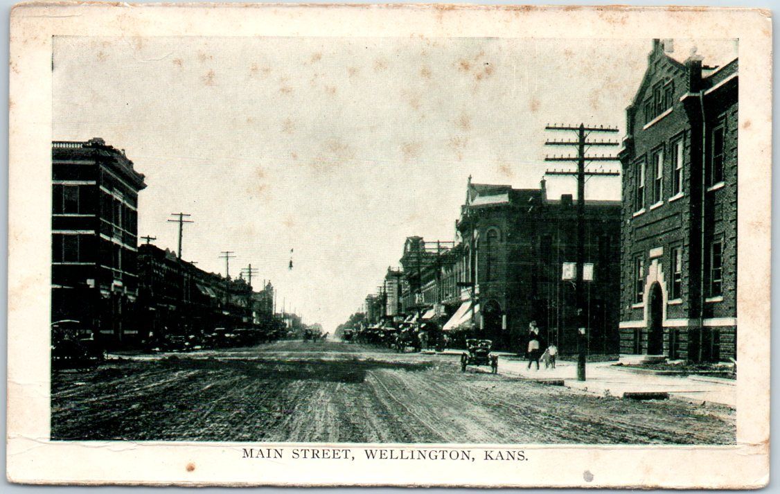 Wellington, Kansas Postcard MAIN STREET Downtown Scene c1910s